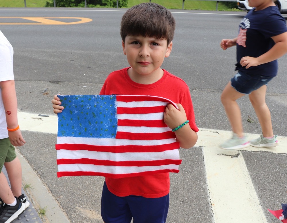 Boy holding an American flag